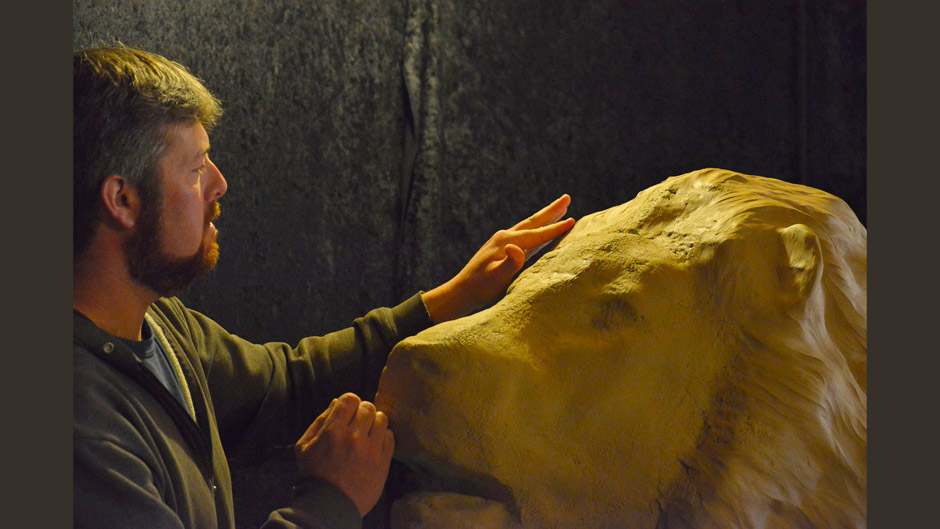 Aaron Yount sculpting monumental lion
